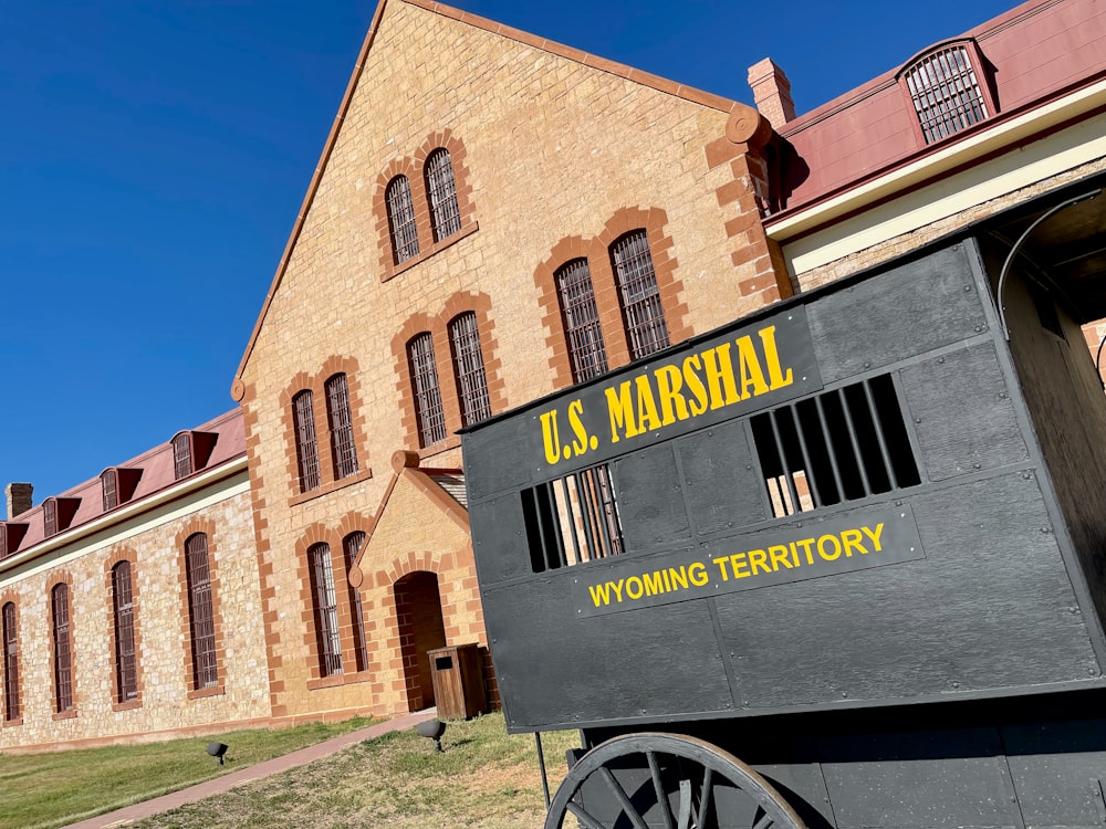 a wagon is parked in front of a building