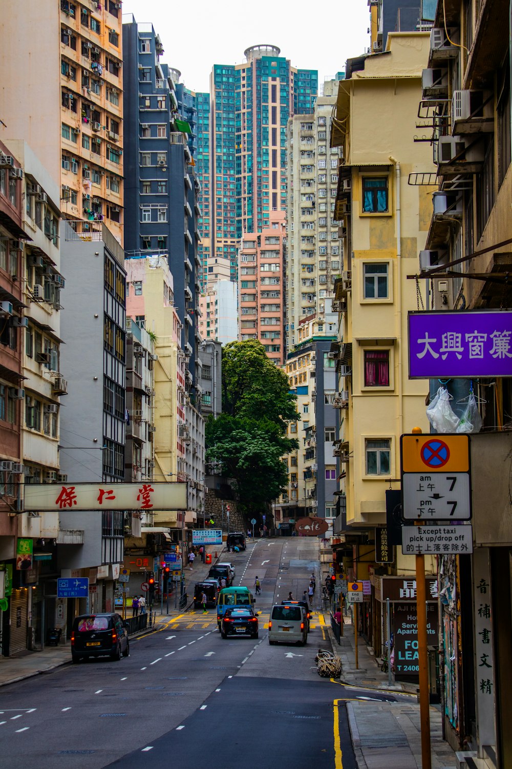 a city street filled with lots of tall buildings