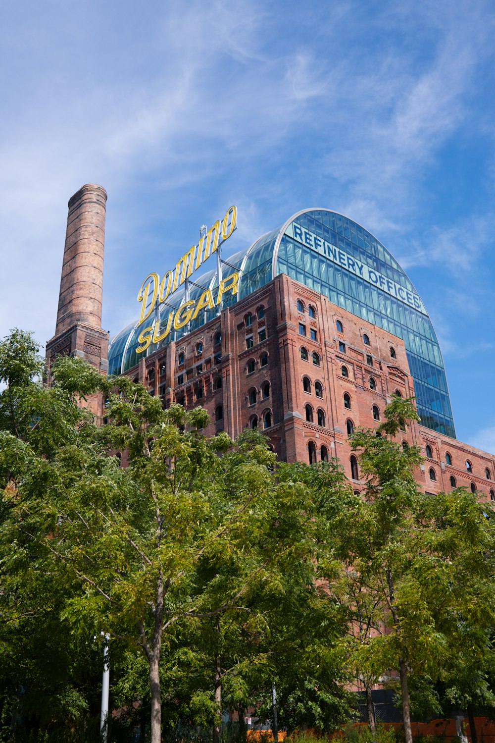 a tall building with a sign on top of it