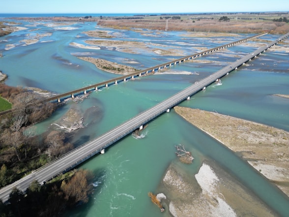an aerial view of a bridge over a river