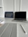 A vibrant workspace with a desk, laptop, and motivational quotes on the wall.