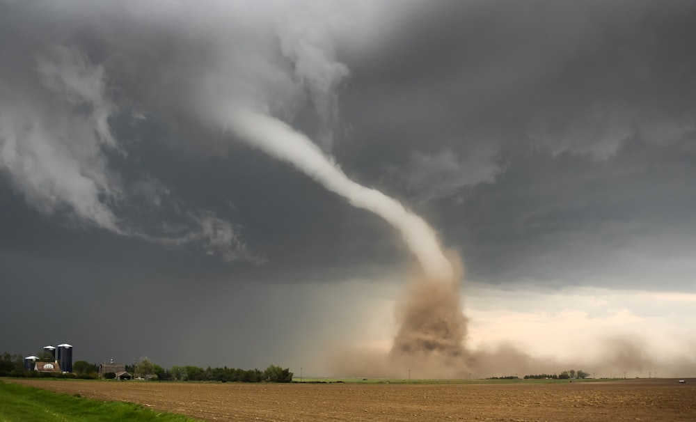 a large tornado is coming out of the sky