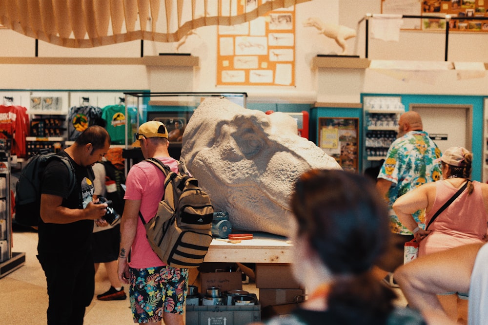 a group of people standing around a store