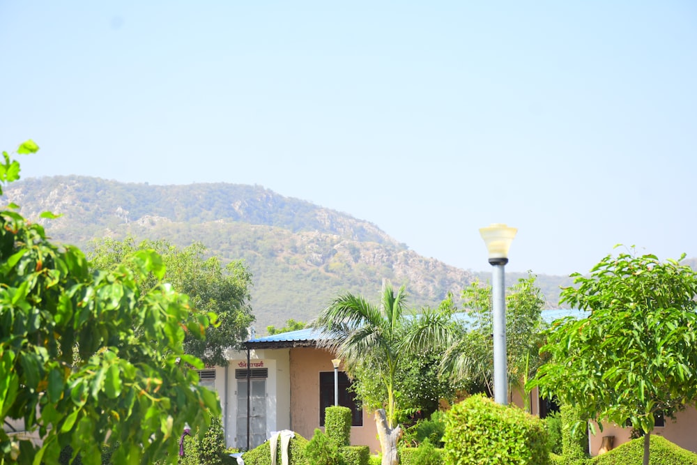 a house with a mountain in the background