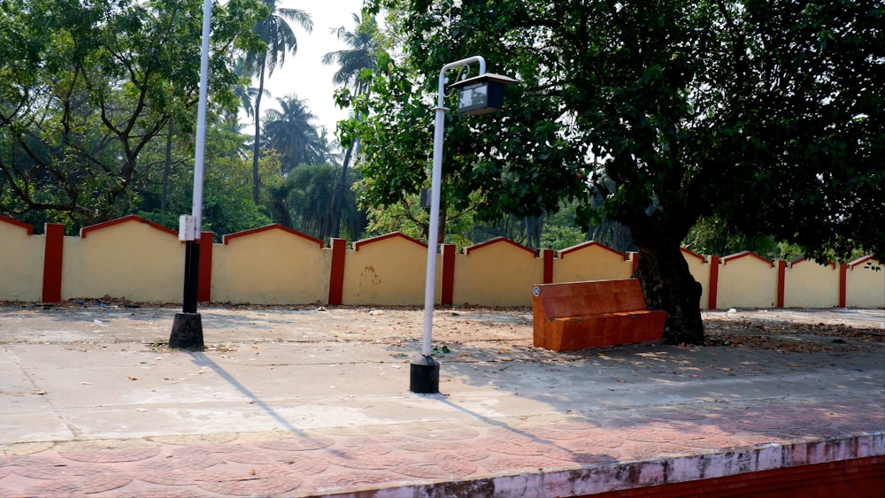 a street light sitting next to a tree