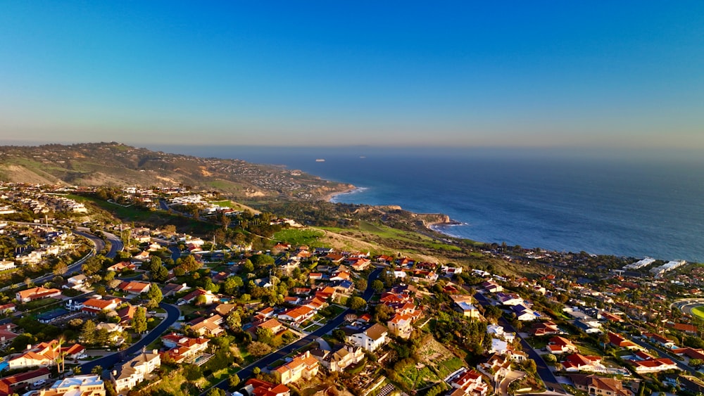 an aerial view of a city by the ocean