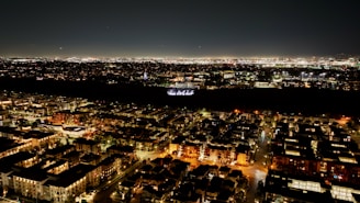 a view of a city at night from the top of a building