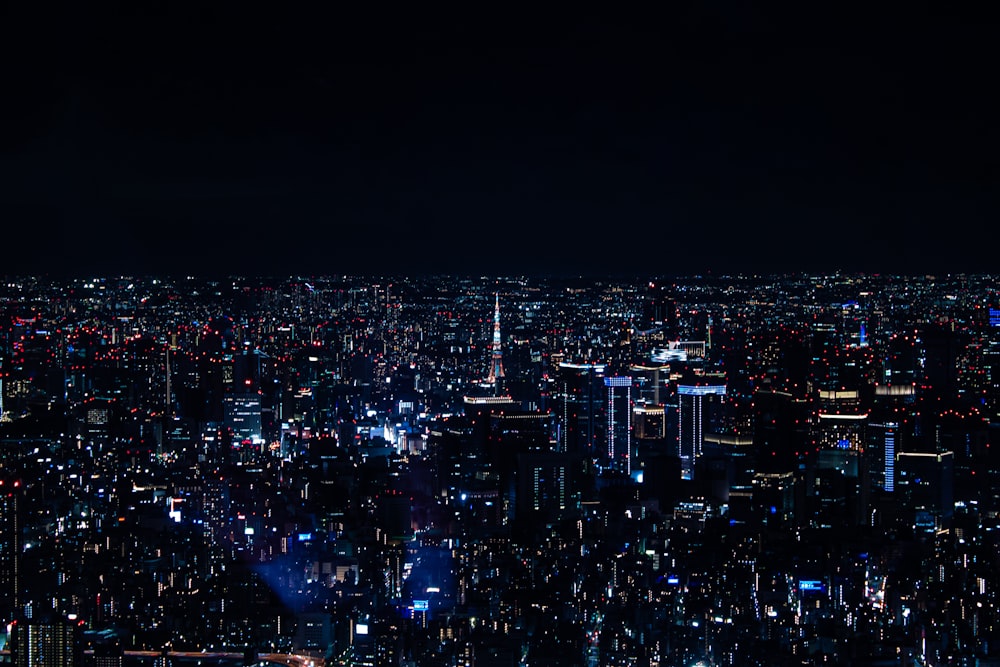 a view of a city at night from the top of a building