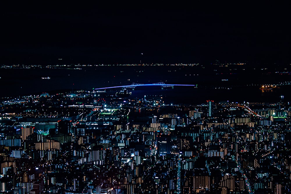 a view of a city at night from the top of a building