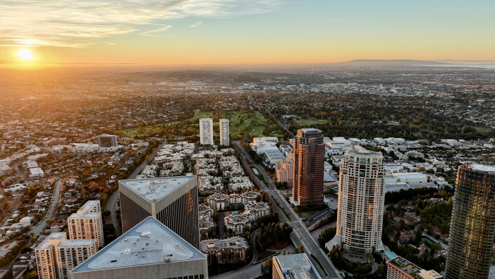 an aerial view of a city at sunset