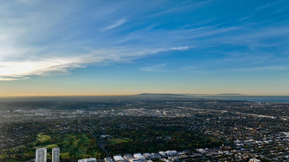 an aerial view of a city and a body of water