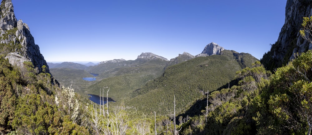 a view of a mountain range with a lake in the middle