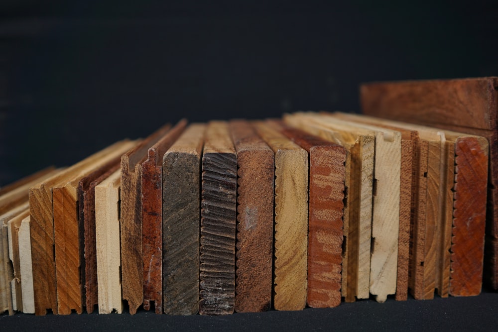 a stack of wooden planks sitting on top of a table