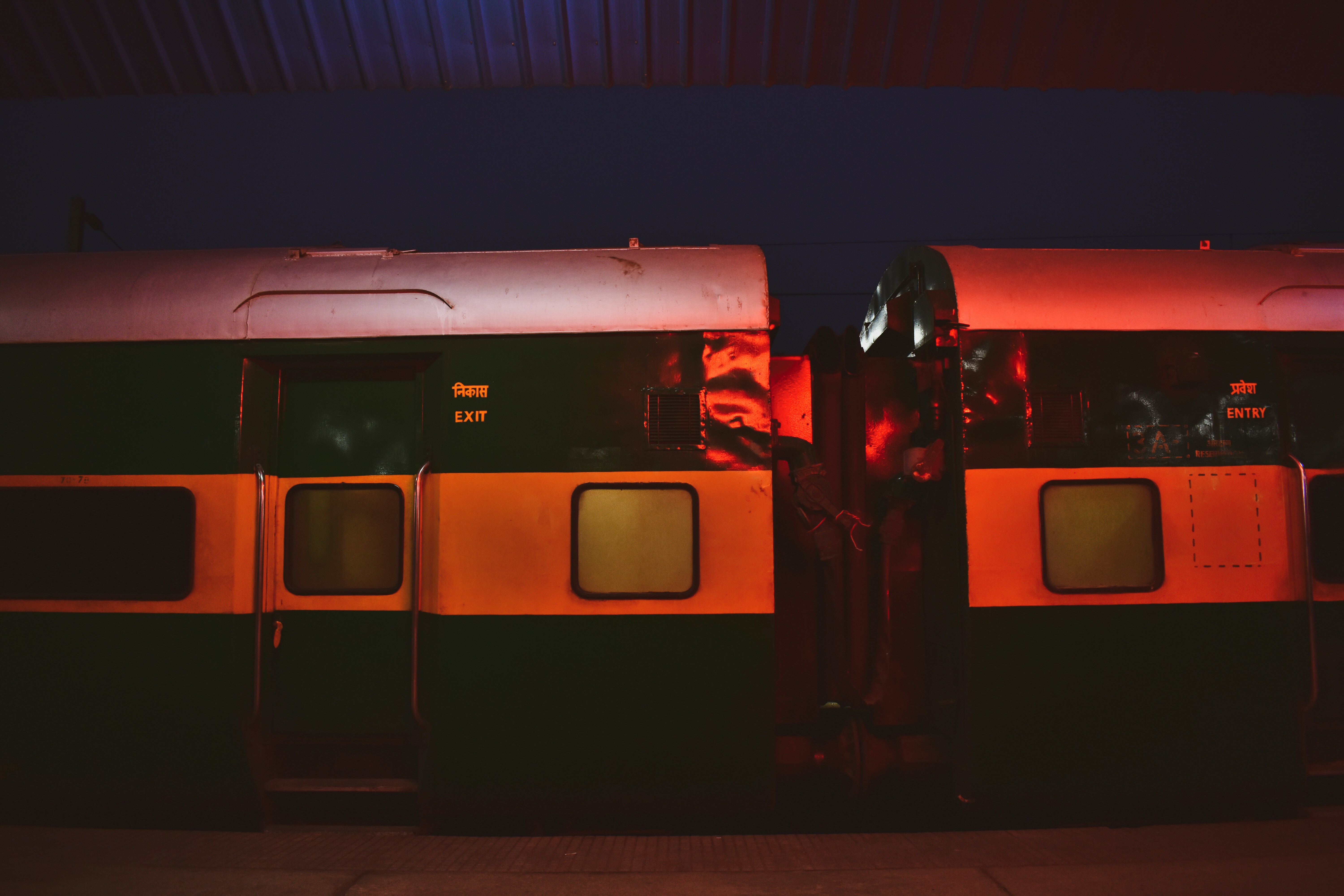 a couple of trains parked next to each other