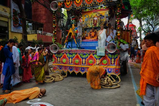 A vibrant procession honoring Karuppasamy with devotees carrying colorful flags in Sivagangai.