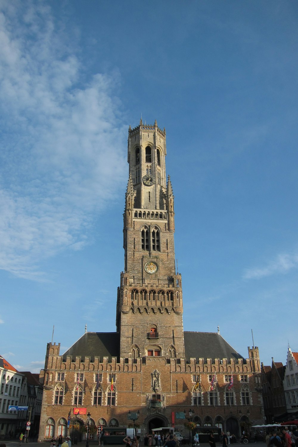 a very tall building with a clock on it's side