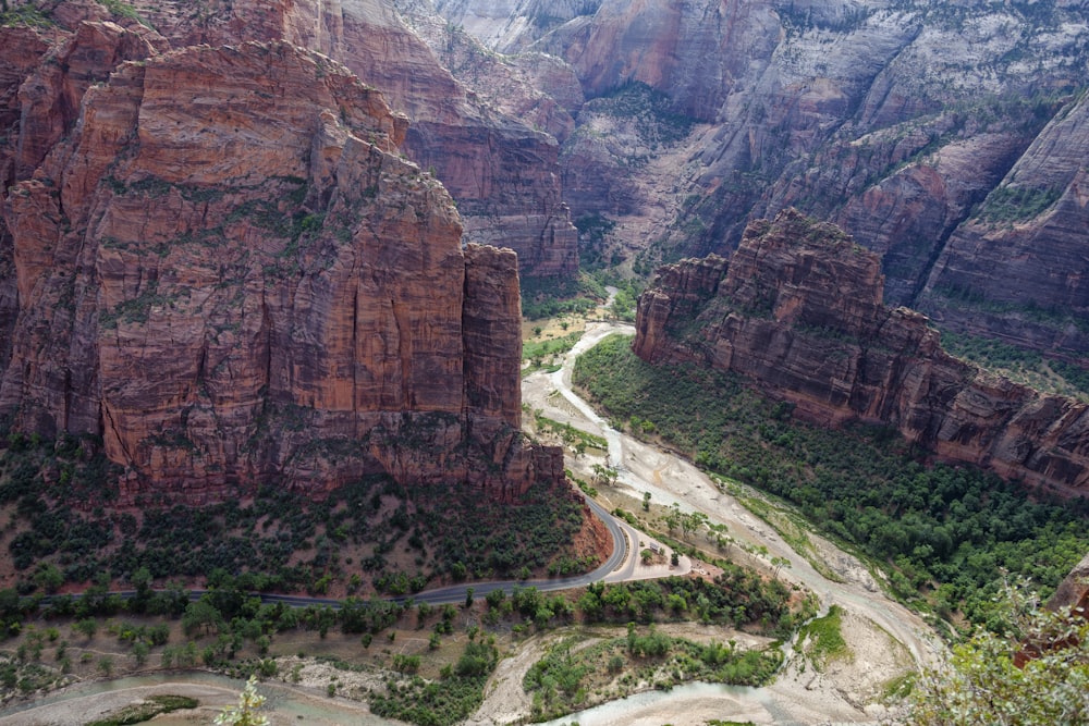 a scenic view of a road winding through a canyon