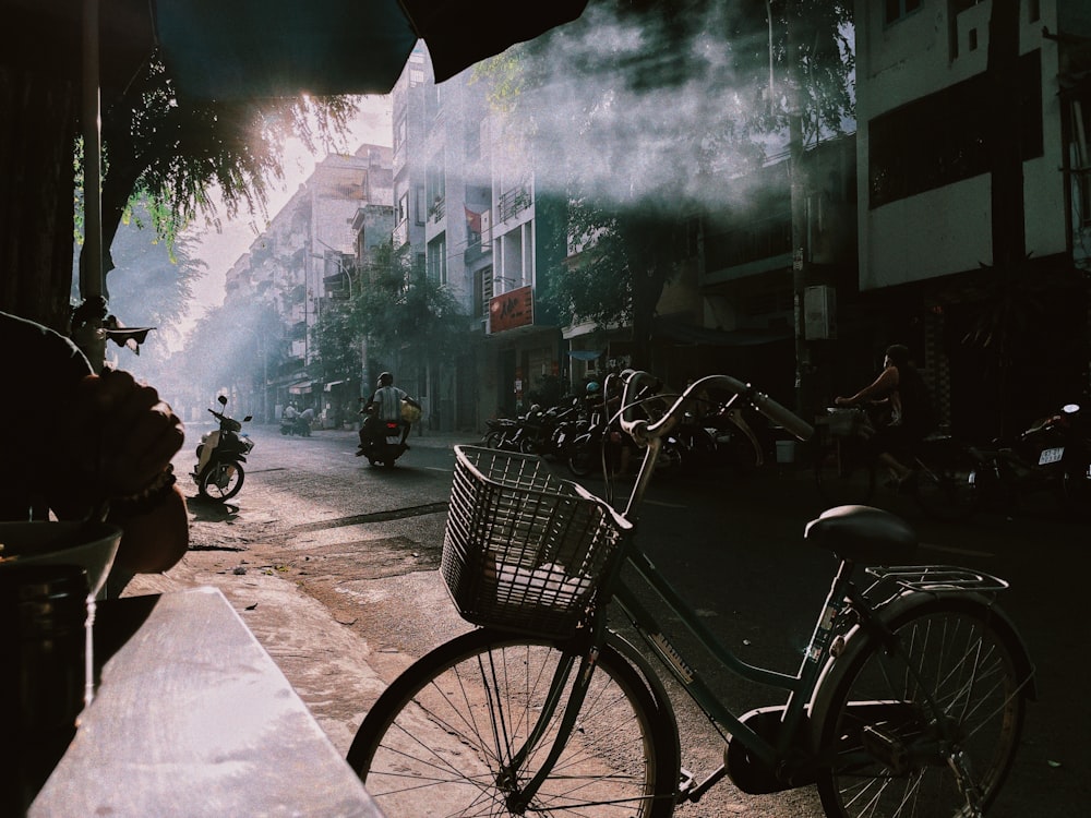 a bicycle parked on the side of a street