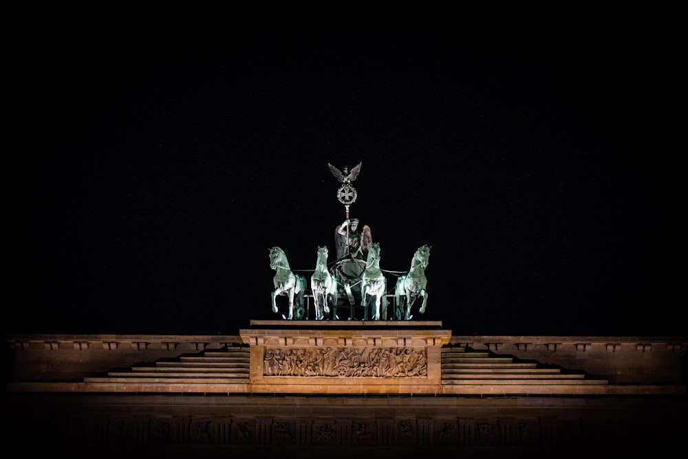 a statue of a man sitting on top of a horse