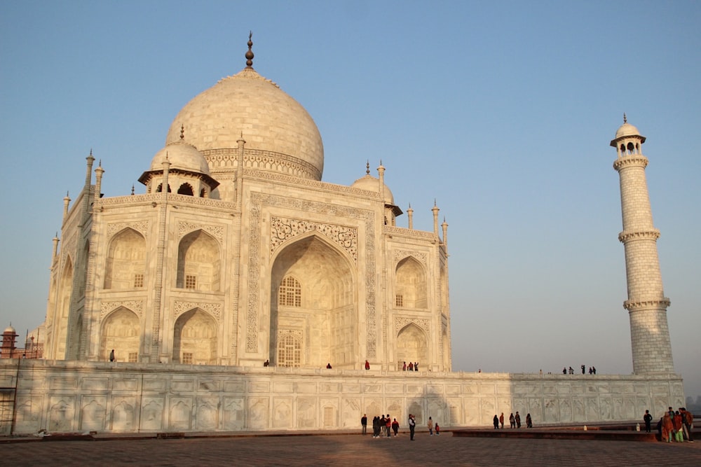 a large white building with two tall pillars