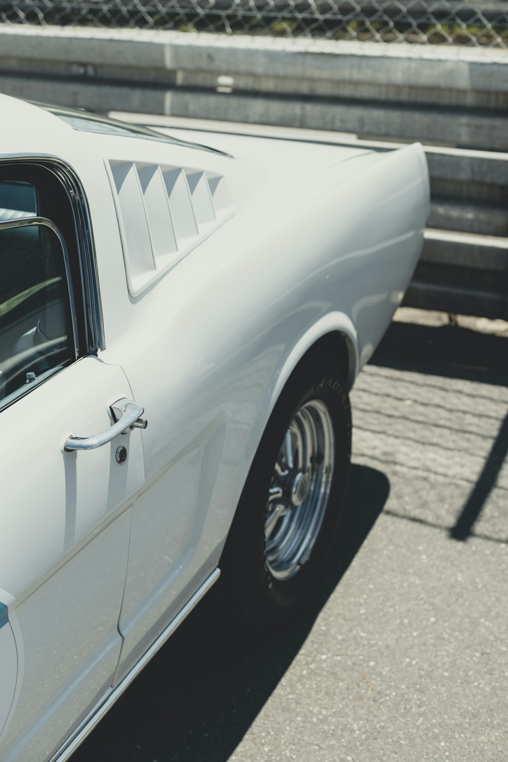 a white car parked on the side of the road