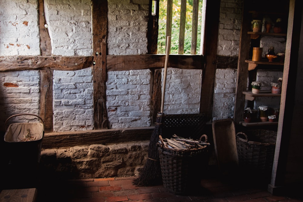 a room with a brick wall and a window