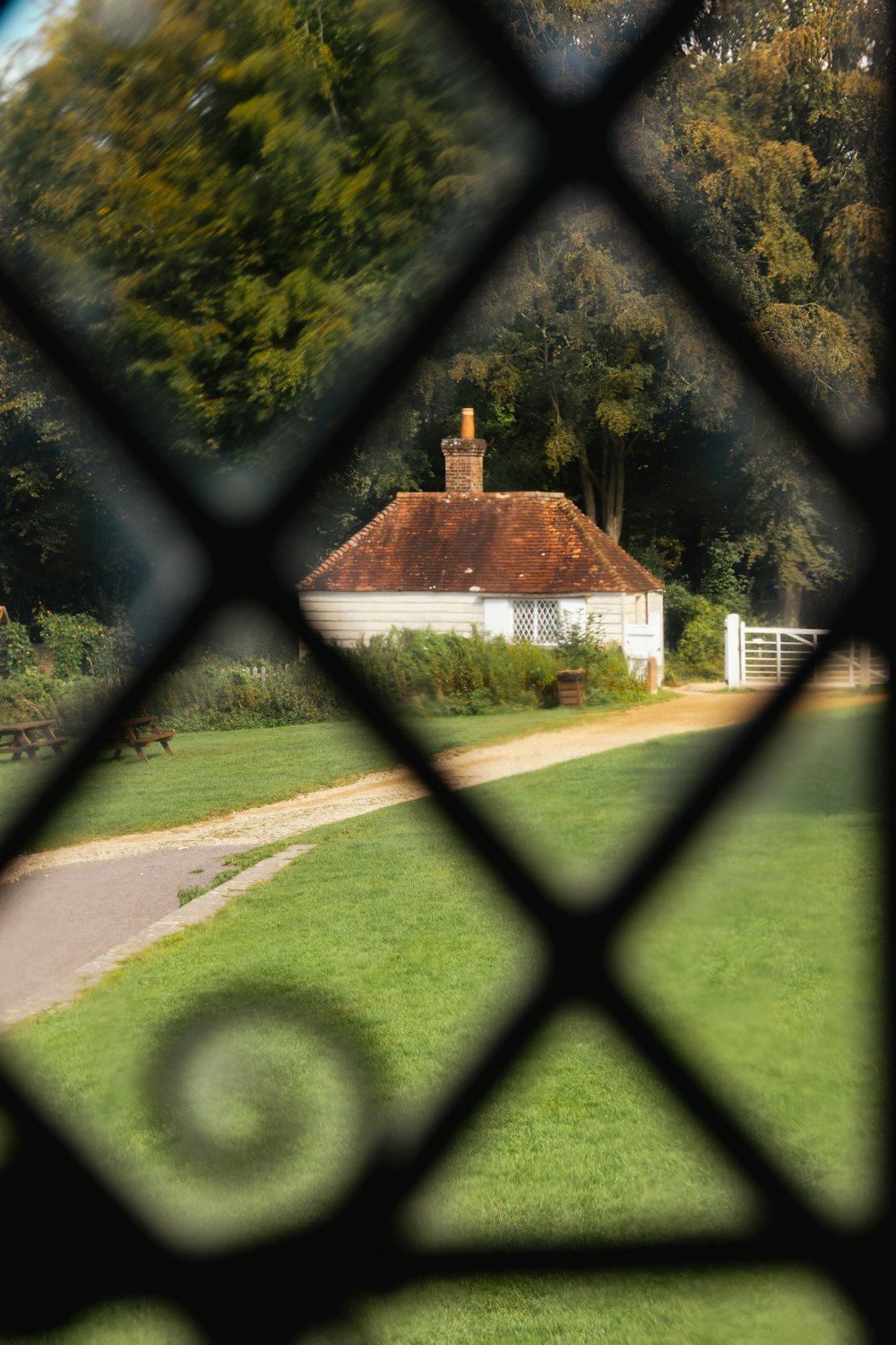 a view of a house through a fence