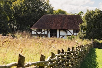Charming exterior of a traditional Shropshire home bathed in warm afternoon light.