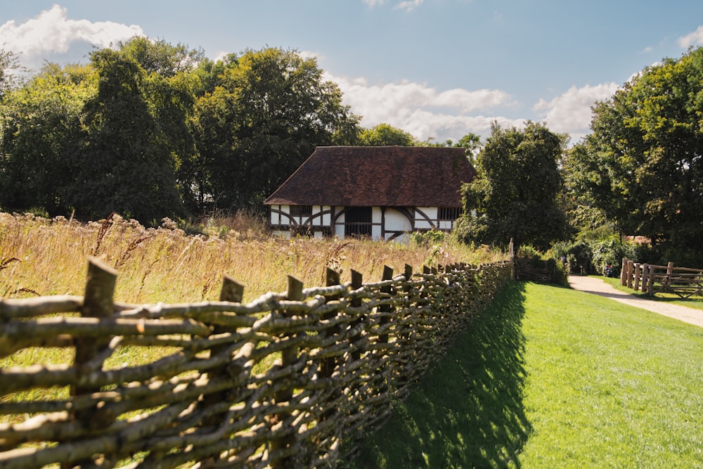 a wooden fence in front of a house