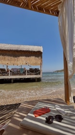 A serene beach setting with a private cabana and luxury amenities.