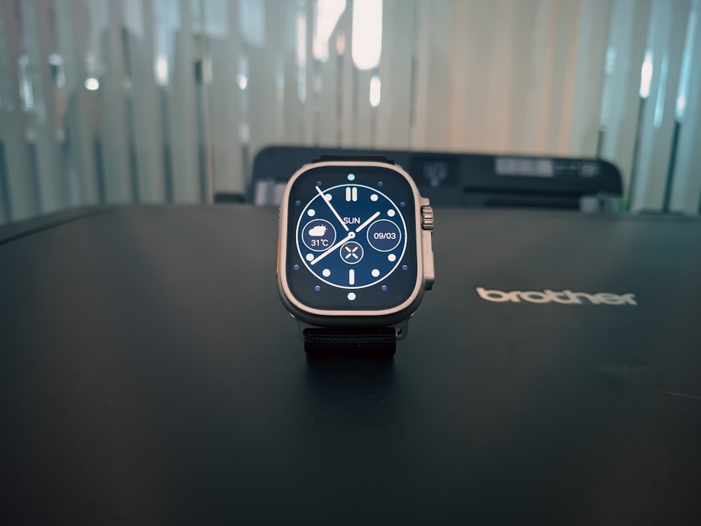 a smart watch sitting on top of a table