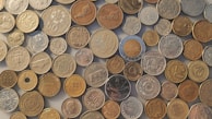An array of ancient coins from various countries.