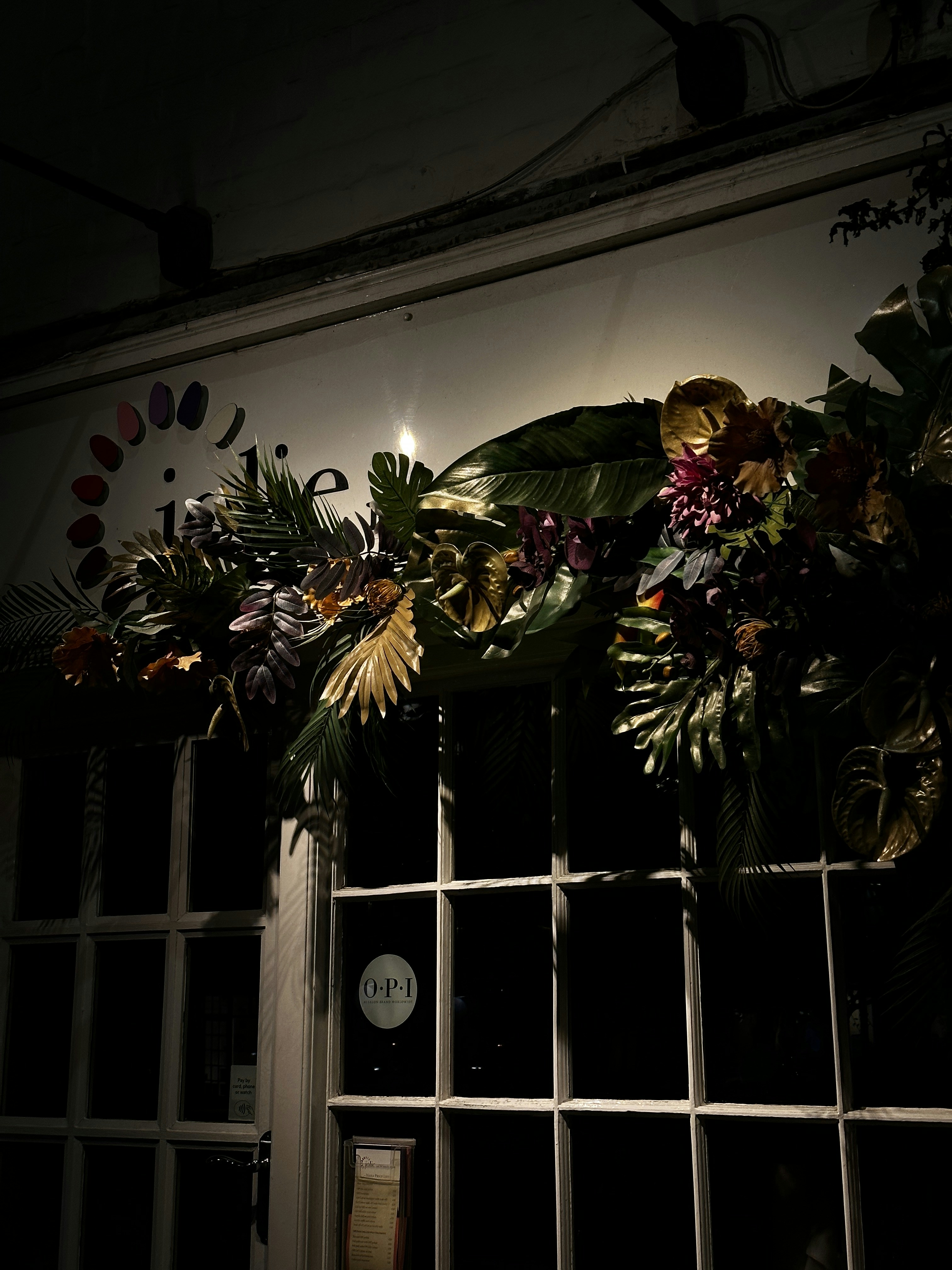 a window with a bunch of flowers on it