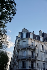 a tall building with balconies and balconies on top