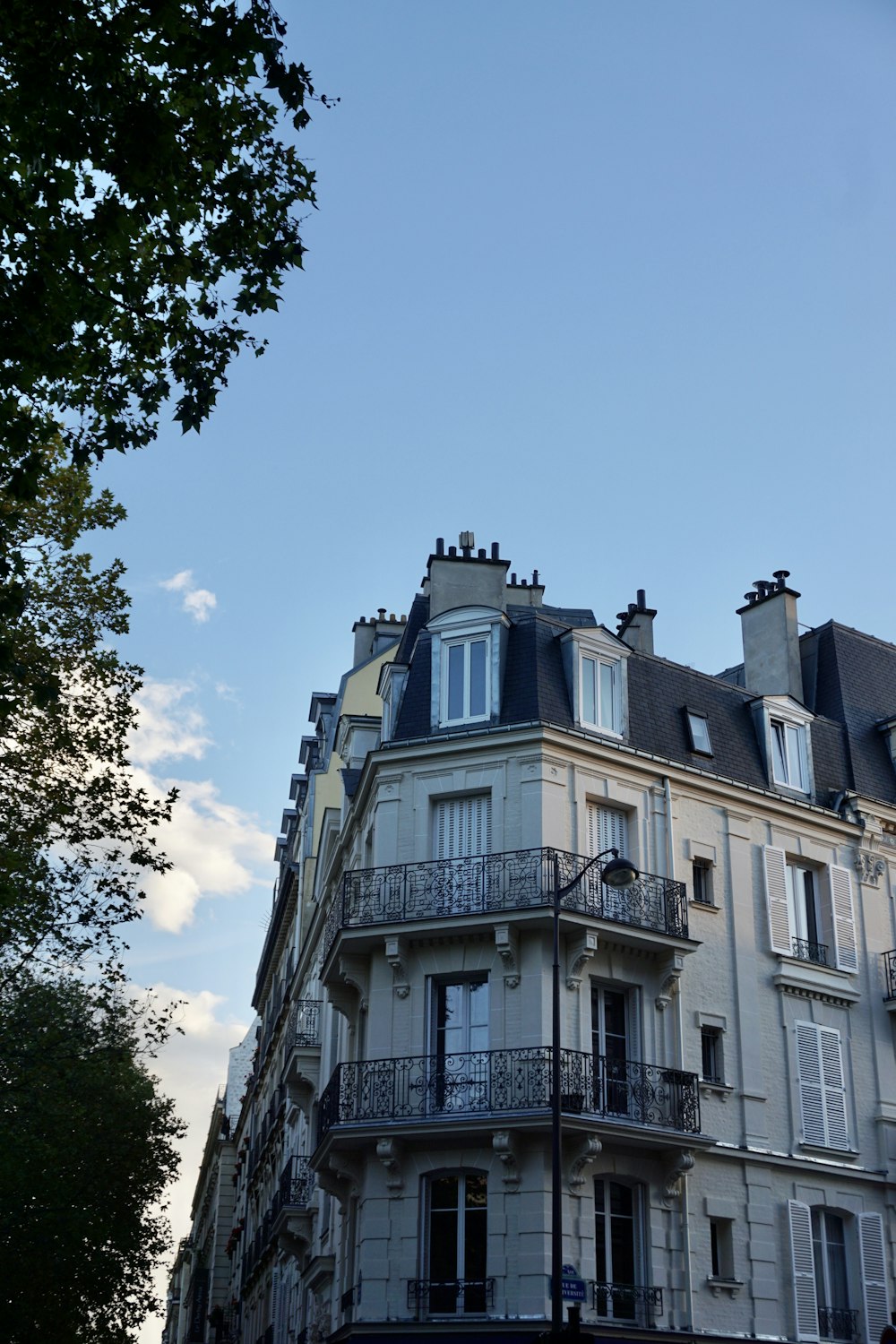 a tall building with balconies and balconies on top