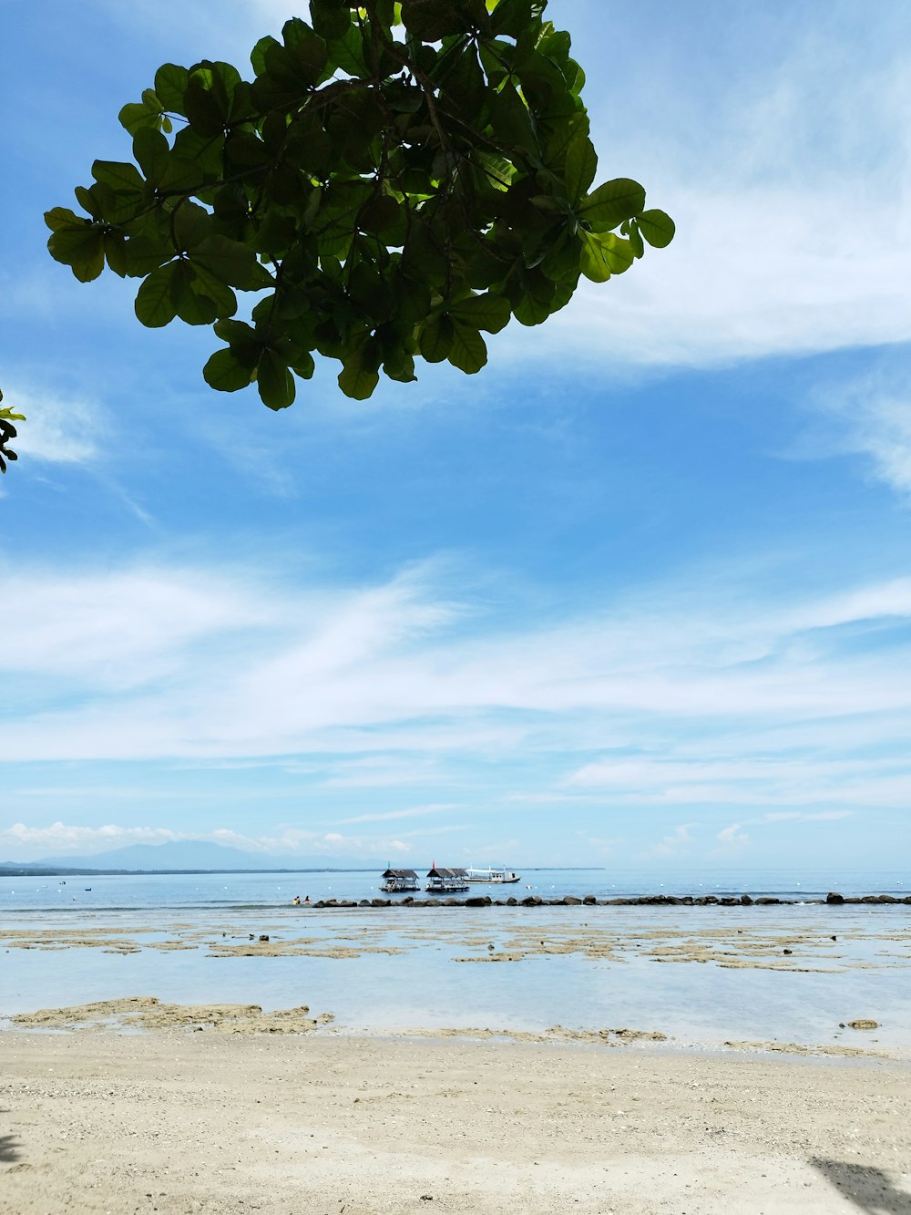 a boat is in the distance on the water