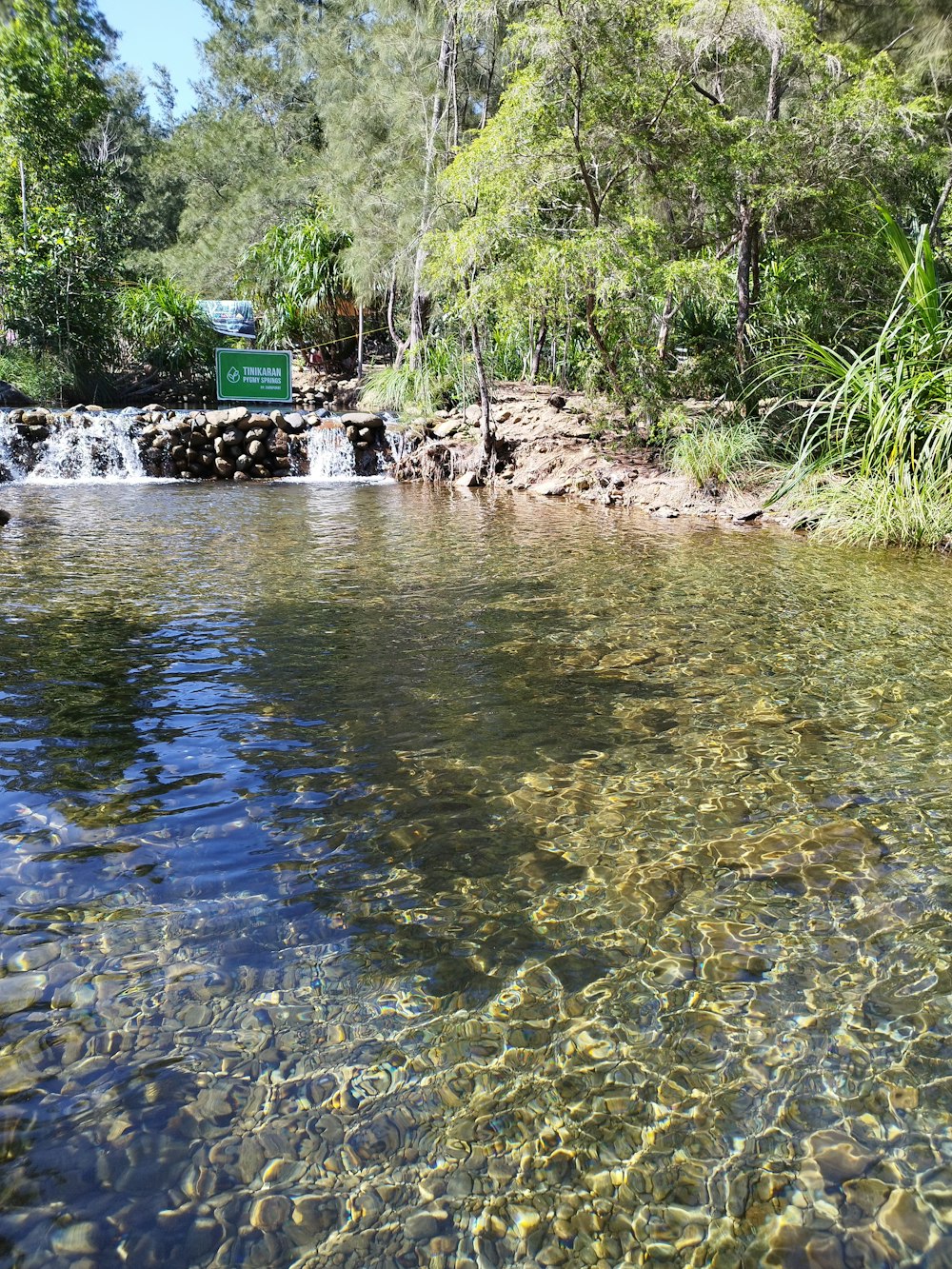 a stream with a green truck in the background