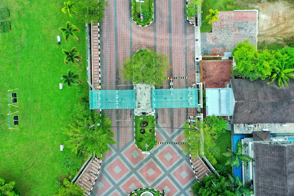 an aerial view of a house with a pool in the middle