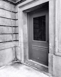 A close-up photo highlighting the sturdy construction of a steel door in a commercial building.