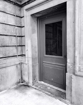 A close-up photo highlighting the sturdy construction of a steel door in a commercial building.