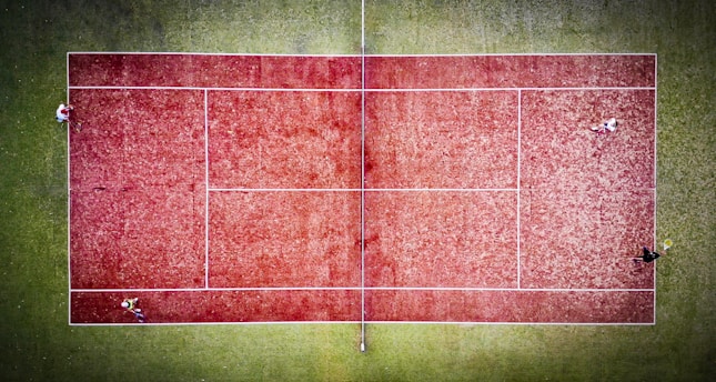 A vibrant tennis court with players in action.