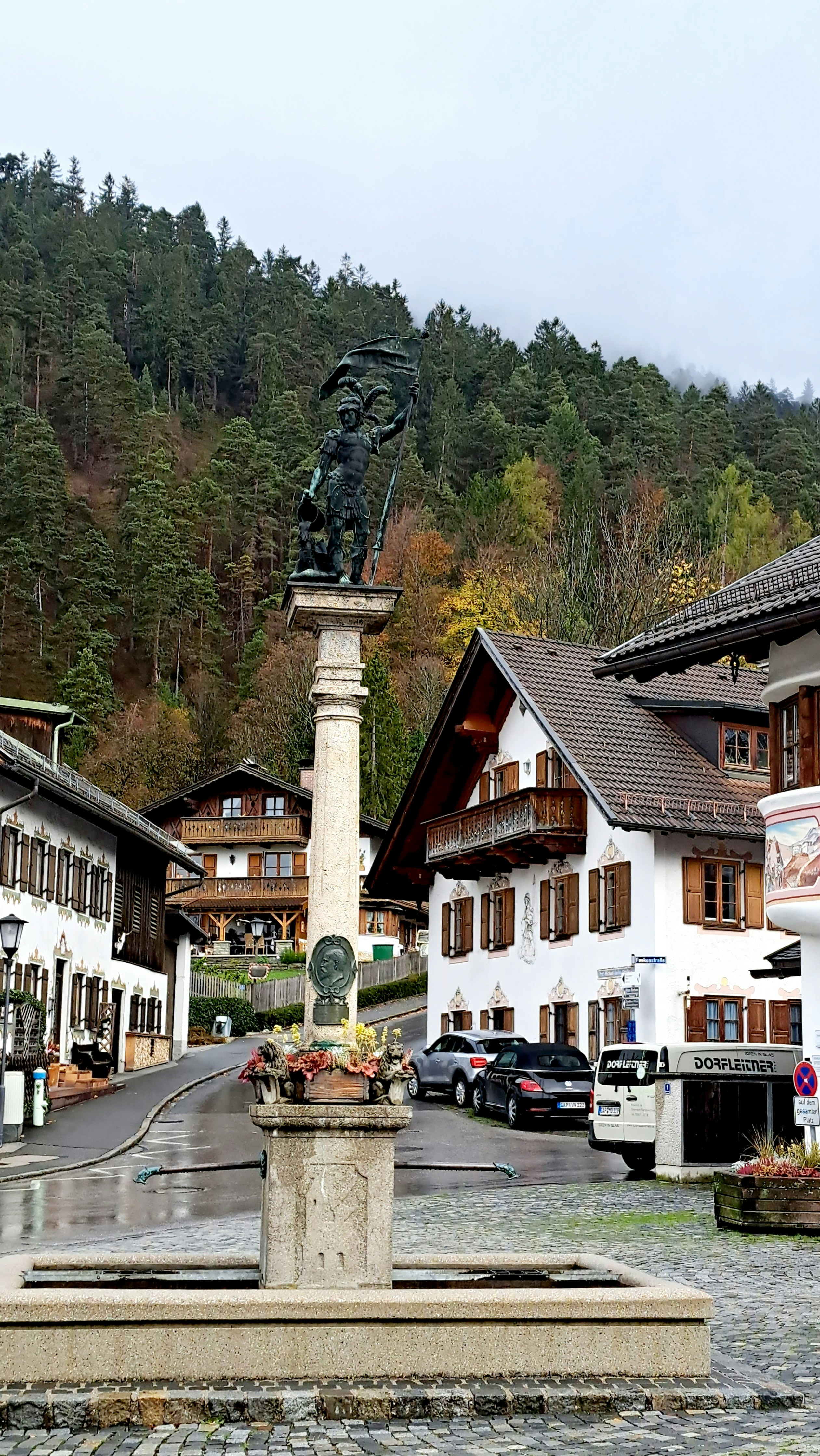 a statue in the middle of a town square