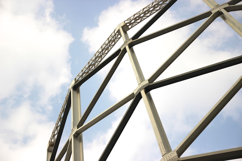 a metal structure with a sky in the background