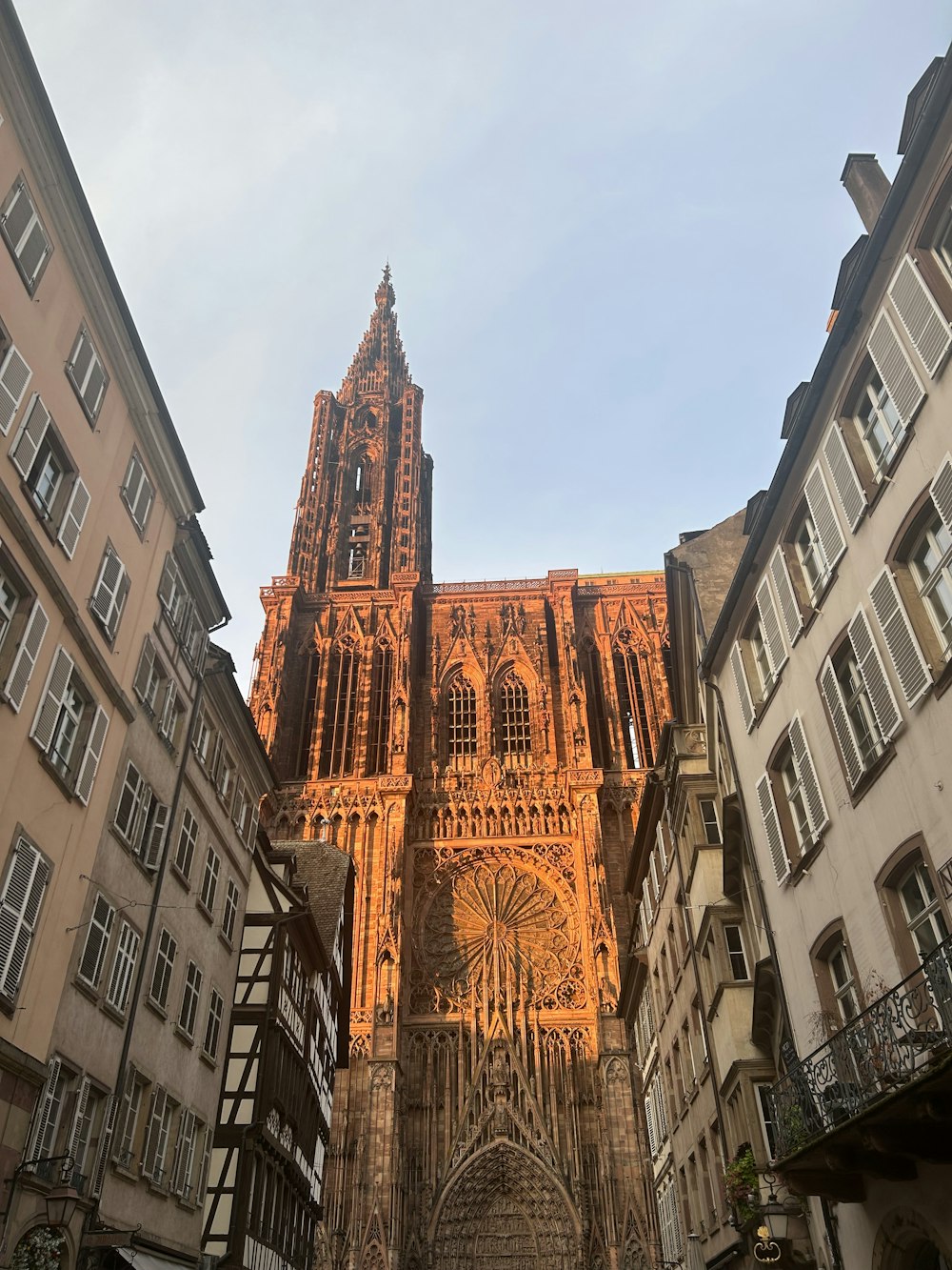 a large cathedral towering over a city filled with tall buildings