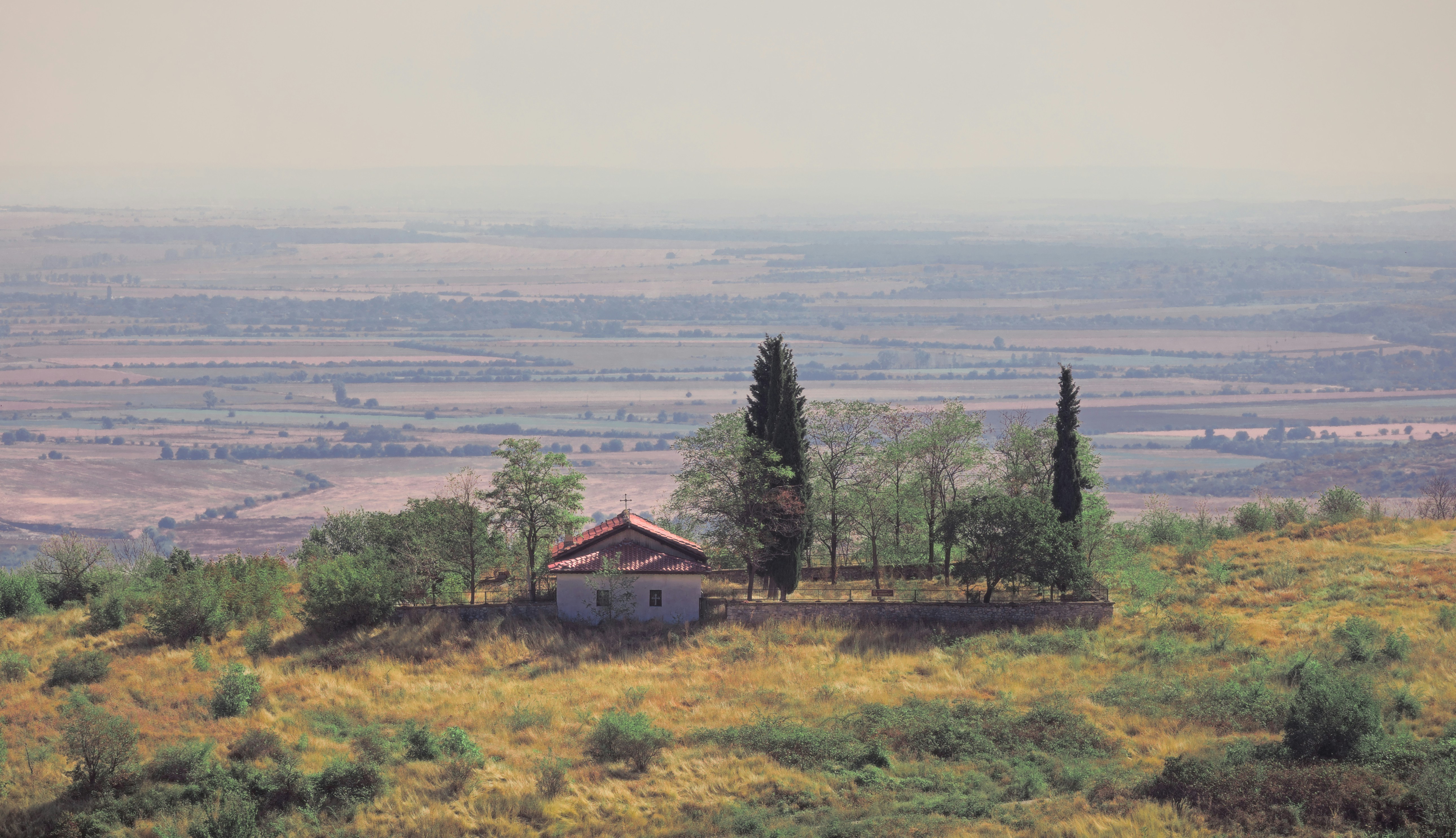 a house on a hill with a view of a valley