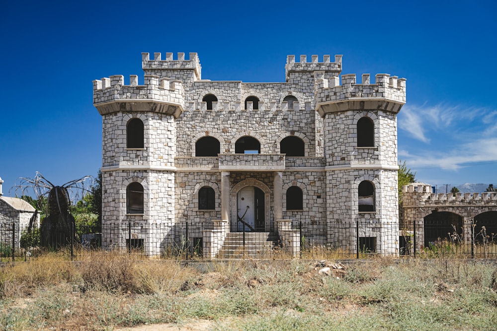 a large castle like building with a clock on the front of it