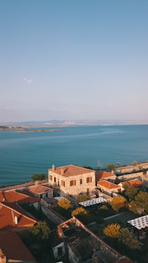 a large body of water sitting next to a city
