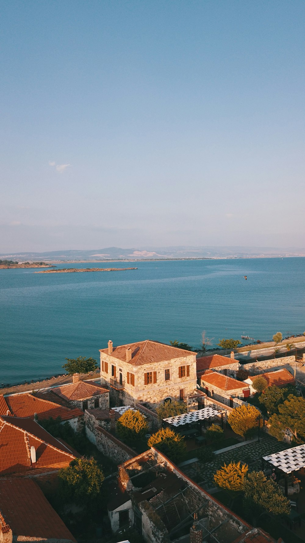 a large body of water sitting next to a city