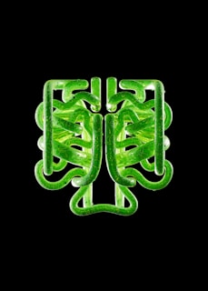 Modern pipe with geometric design in black and icy blue tones against a dark background.