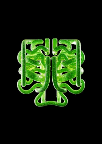 Modern pipe with geometric design in black and icy blue tones against a dark background.